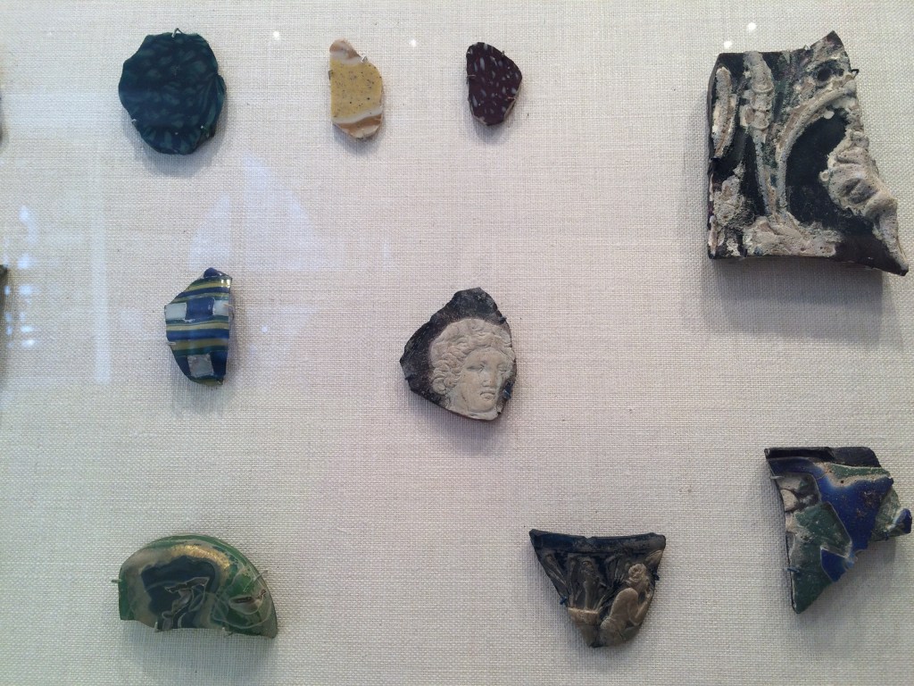 The original photo that the illustration at left was based on. Shards of pottery on display at the Metropolitan Museum of Art, NY.